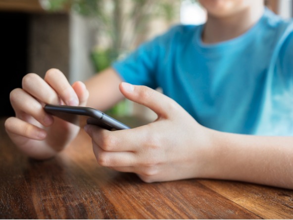 teenage boy using a smartphone